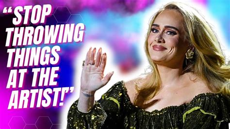 Adele slams fans who throw items on stage: '“I f---ing dare you'